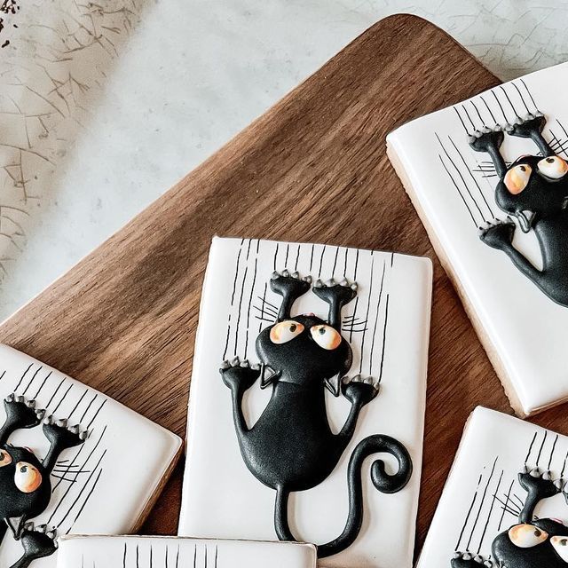 Whimsical Black Cat Decorative Cookies Inspire Playful Nail Designs.