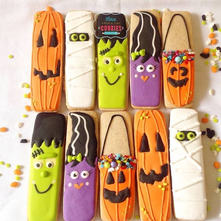 Festive Halloween Cookies Display: Colorful Character Designs and Cheerful Expressions for Spooky Celebrations