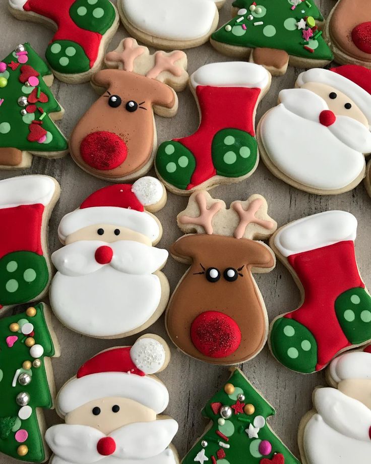 Whimsical Hand-Decorated Holiday Cookie Assortment Featuring Santa, Rudolph, Christmas Trees, and Stockings.