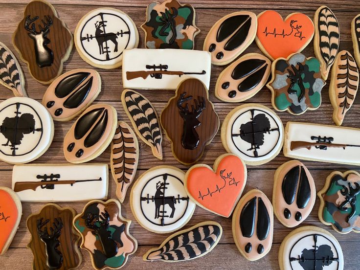 Hunting-Themed Colorful Cookies with Intricate Icing Designs and Earthy Accents.