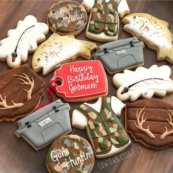 Playful Themed Cookie Assortment with Hunting and Fishing Motifs for Celebrations.