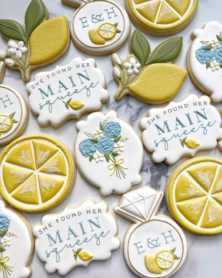 Whimsical Lemon and Floral Cookie Designs in Cheerful Yellow and Soft Blue Tones.