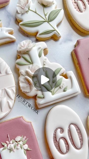 Elegant Floral-Themed Cookies with Intricate Iced Decorations in Soft Pastels.