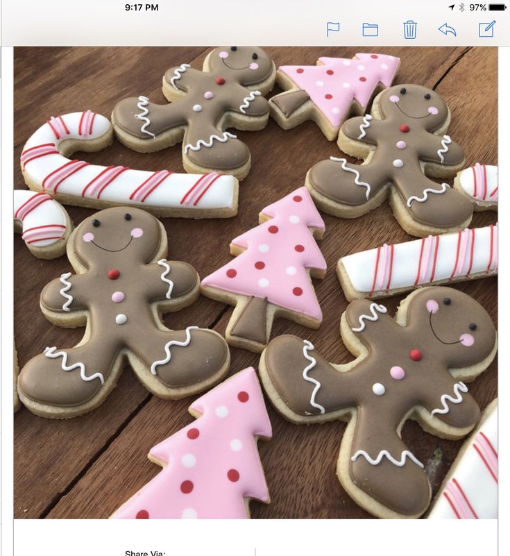 Festive Cookie-Inspired Nail Designs: Gingerbread Men, Candy Canes, and Christmas Trees.