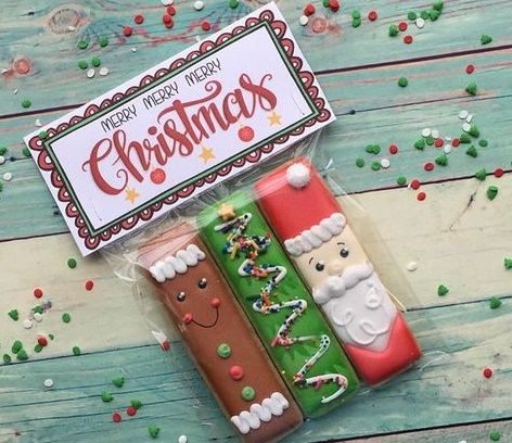 Cheerful Festive Cookie Design Showcasing Gingerbread Man, Christmas Tree, and Jolly Santa Claus.