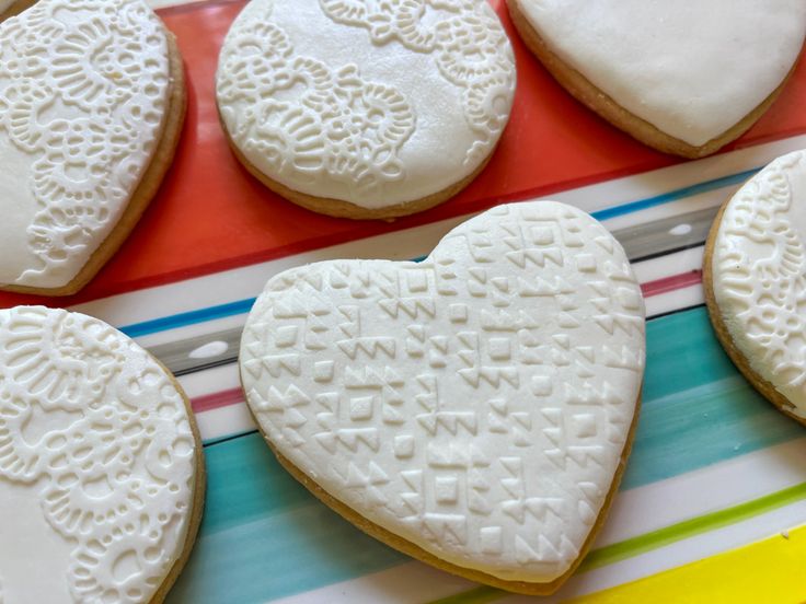 Charming Heart-Shaped Cookies with Intricate Icing and Delicate Designs for Special Occasions