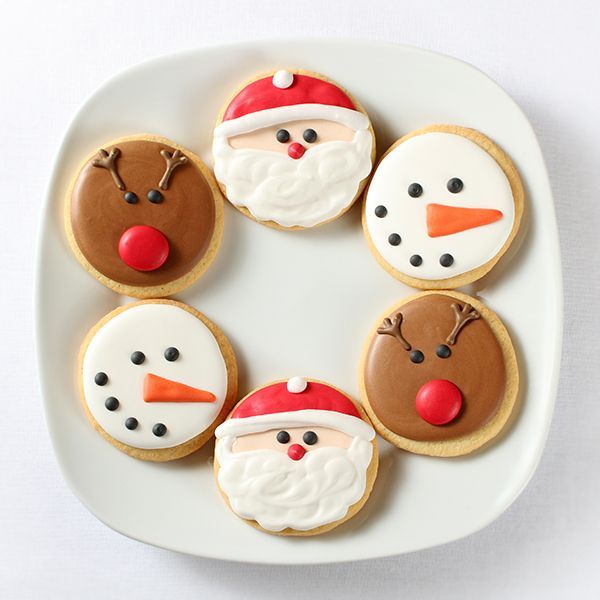 Festive Holiday Cookies Showcase Creative Designs on a White Plate.