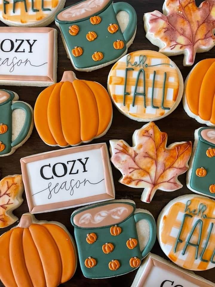 Vibrant Autumn Cookies: Festive Pumpkin Shapes, Cozy Mugs, and Intricate Leaf Designs.