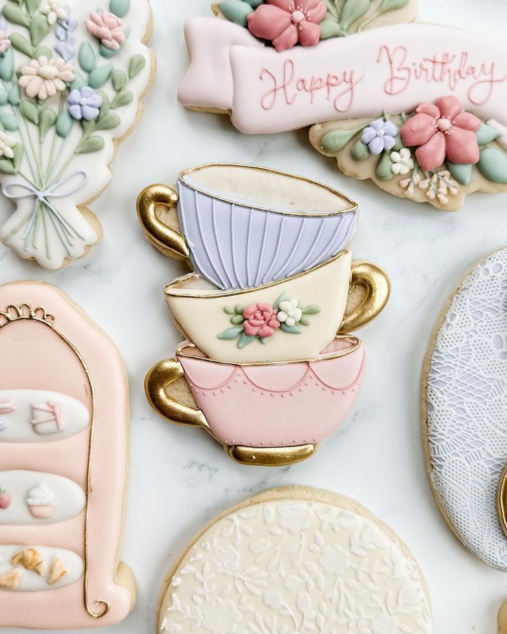 Whimsical Pastel Cookie Designs Featuring Elegant Teacups and Floral Accents