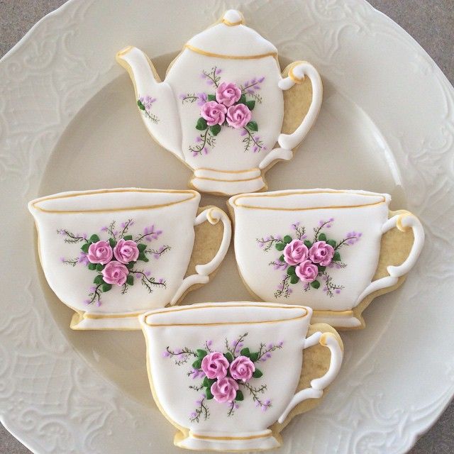 Whimsical Floral Teacup and Teapot Designs in Soft Pastels for Elegant Nail Art.