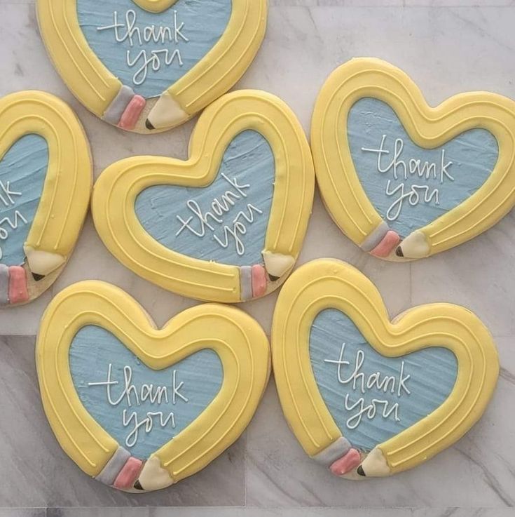 Playful Pastel Heart-Shaped Cookies with Whimsical Designs for Celebrations.