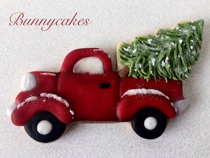 Festive Vintage Pickup Truck Cookie with Christmas Tree and Frosted Snow Details.