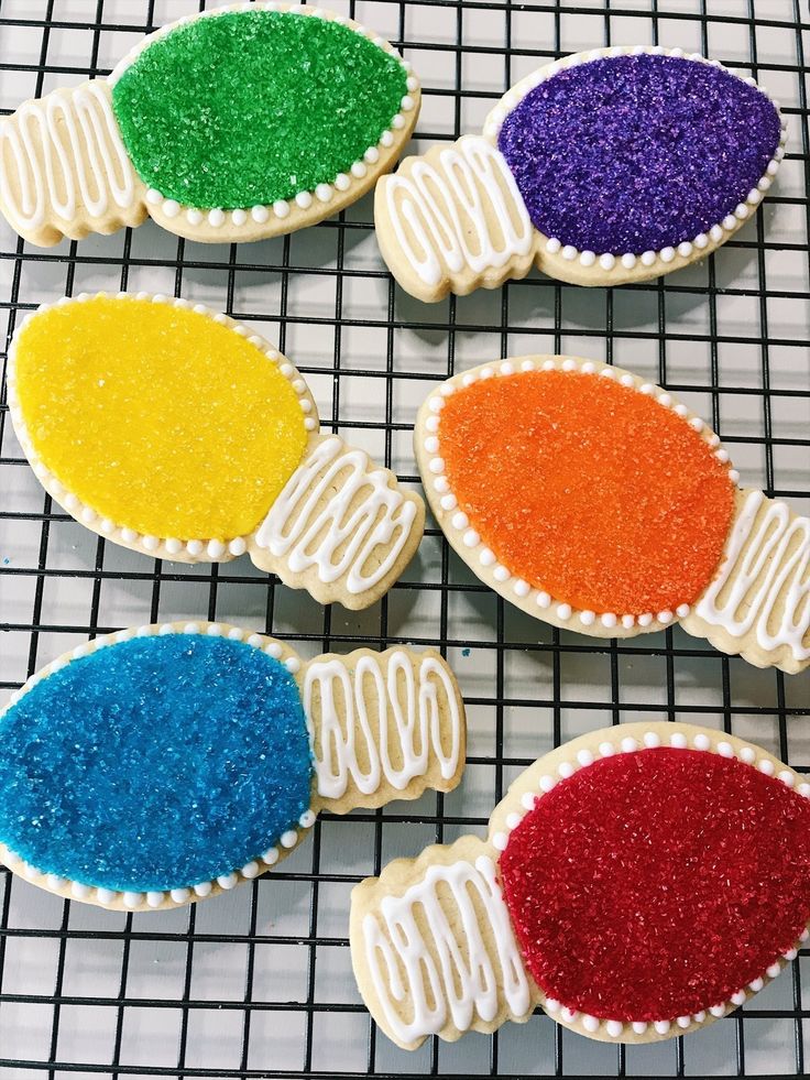 Vibrant Christmas Light-Shaped Cookies Adorned with Colorful Icing and Sprinkles.