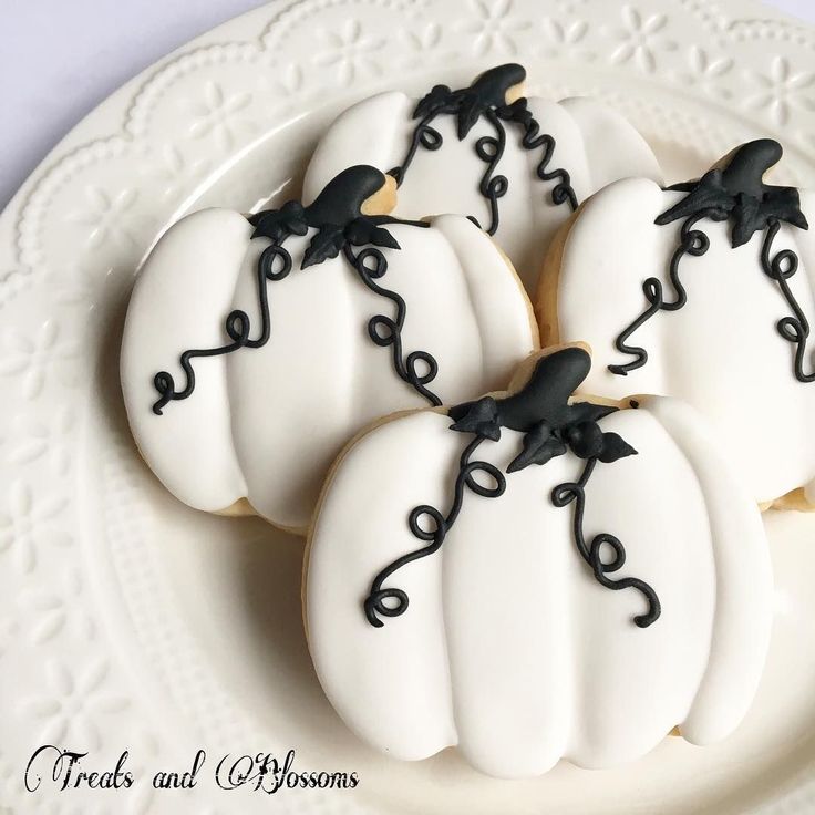 Whimsical Pumpkin-Themed Cookies: A Festive Fusion of Artistry and Elegance for Fall Celebrations.