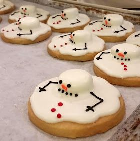 Whimsical Winter Cookie Design: Cheerful Snowmen on Festively Decorated Treats.