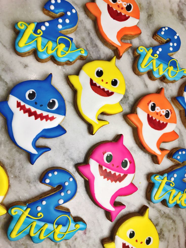 Vibrant Shark-Shaped Cookies: Whimsical Treats for Festive Celebrations.