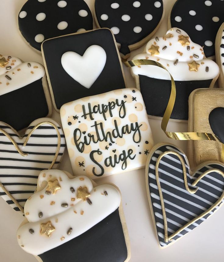 Chic Black, White, and Gold Decorative Heart-Shaped Cookies Perfect for Celebrations.