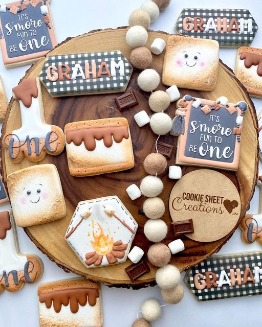 Whimsical S'mores-Themed Cookie Designs on a Cheerful Wooden Platter.