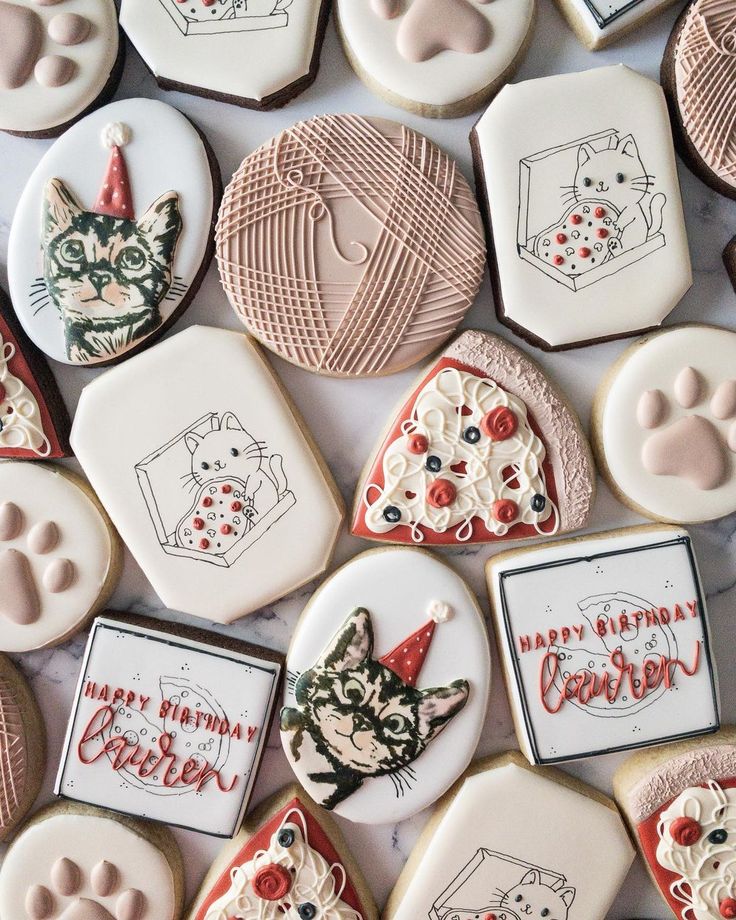 Whimsical Cat-Themed Decorative Cookies with Festive Designs.