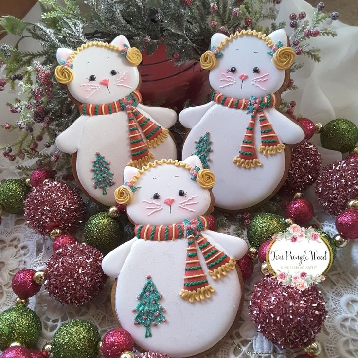 Cheerful Festive Cat-Shaped Cookies Adorned with Colorful Scarves and Whimsical Decor.