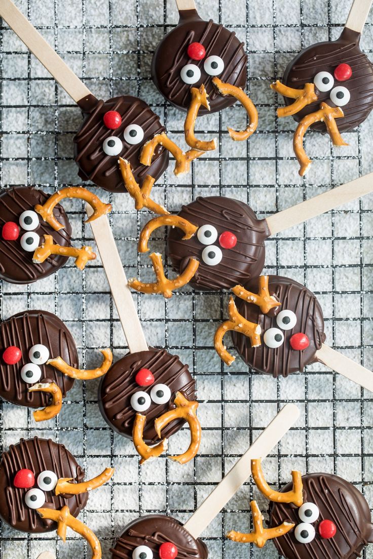 Whimsical Chocolate-Covered Reindeer Treats with Festive Accents.