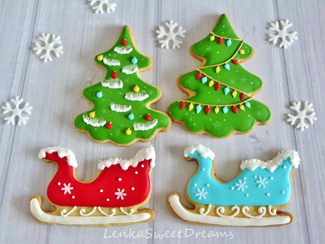 Whimsical Festive Cookie Designs: Colorful Christmas Trees and Sleighs for a Cheerful Holiday Display.