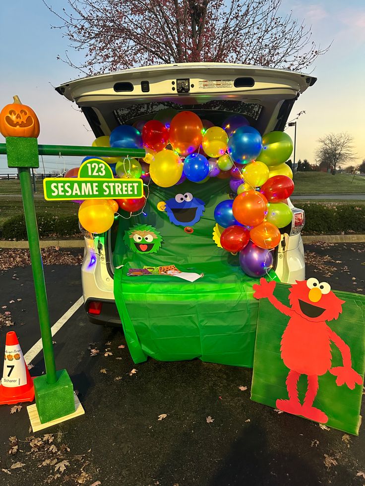 Festive and Playful Car Trunk Display with Colorful Balloons and Beloved Characters