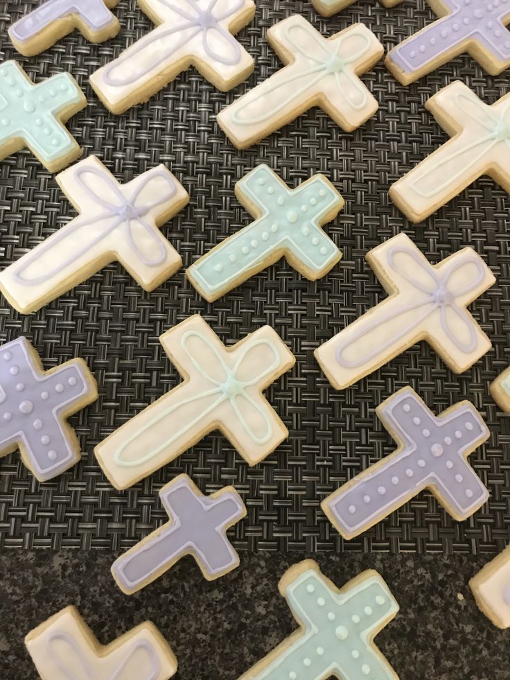 Serene Aesthetic: Elegant Cross Designs in Soft Pastels for Themed Nail Art Inspiration.