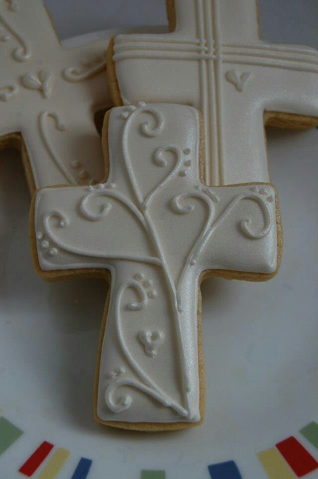 Elegant Cross-Shaped Cookies with Delicate Icing for Special Occasions.