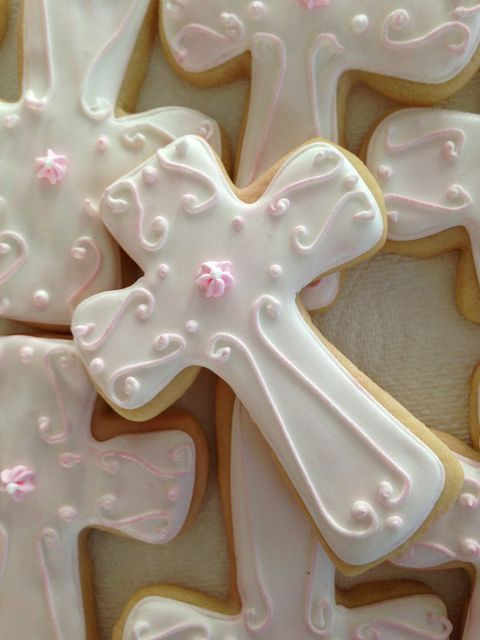 Charming Pink Iced Cross Cookies for Celebrations and Religious Events.