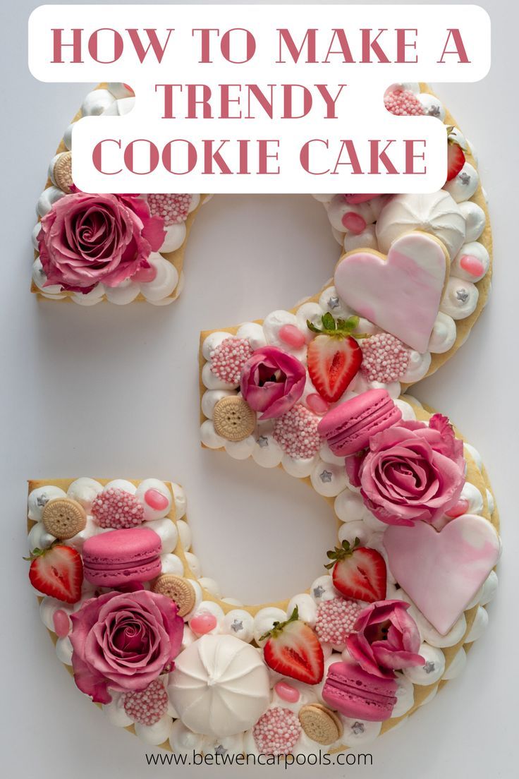 Vibrant Cookie Cake Design: A Delightful Celebration Centerpiece with Sweets and Fresh Roses.