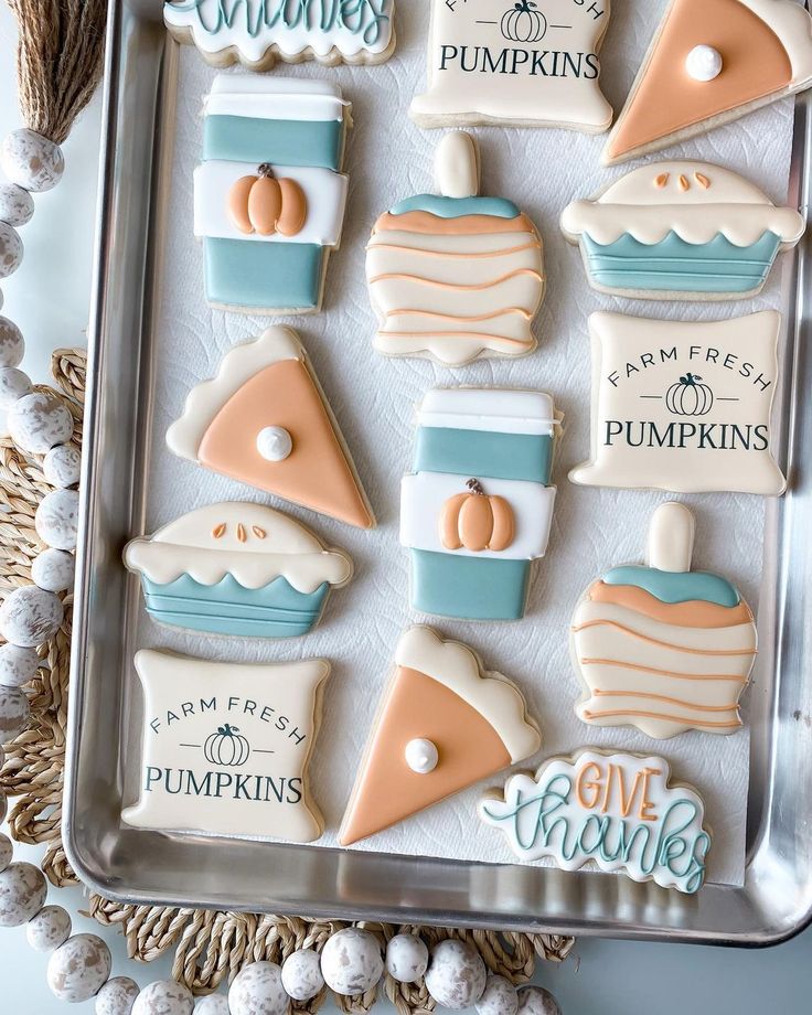 Charming Fall-Themed Festive Cookies: Whimsical Pumpkin, Pie, and Coffee Cup Designs in Pastel Hues.