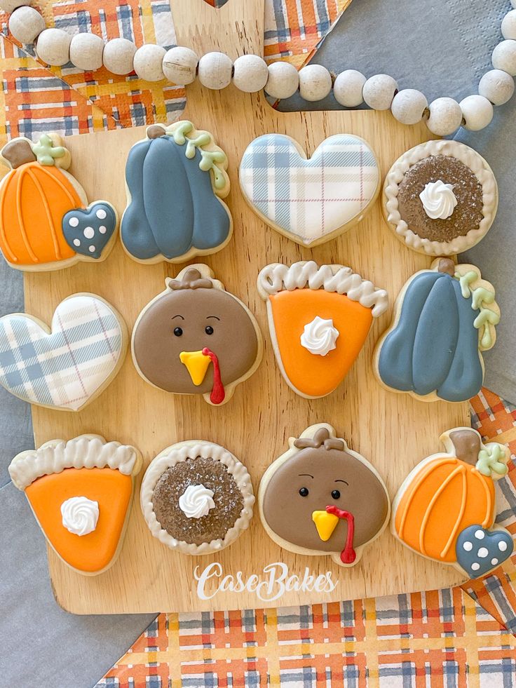 Festive Autumn-Themed Cookies Displayed on Wooden Platter.