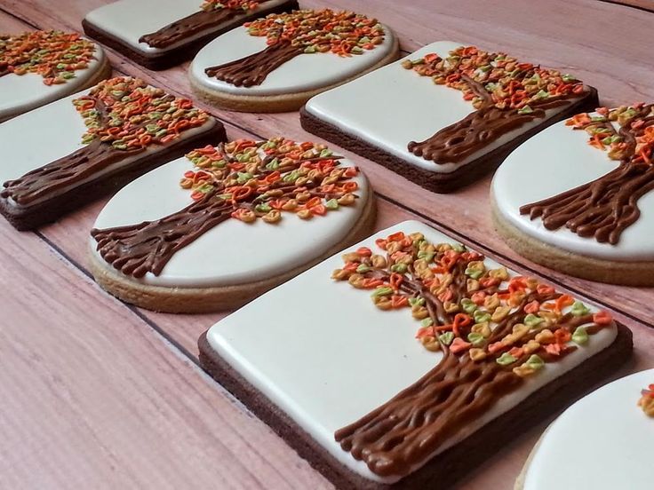 Autumn-Inspired Cookies with Detailed Tree Designs and Vibrant Fall Colors.