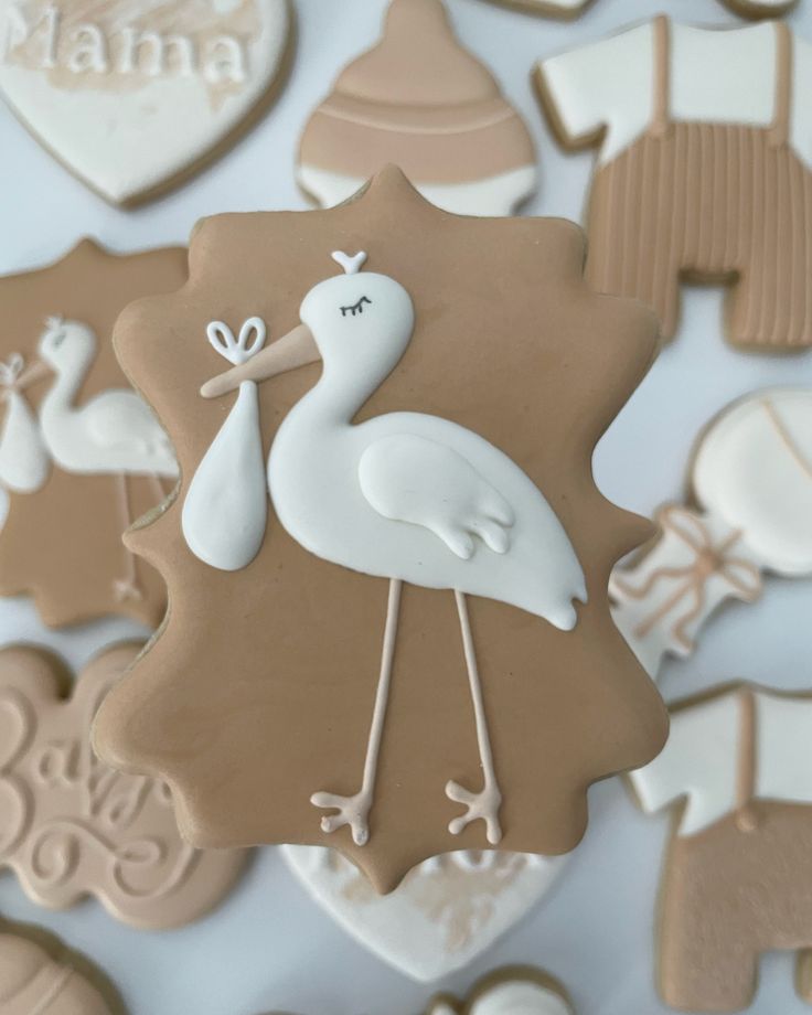 Whimsical Stork-Themed Cookies: Elegant, Gender-Neutral Decor for Baby Showers.