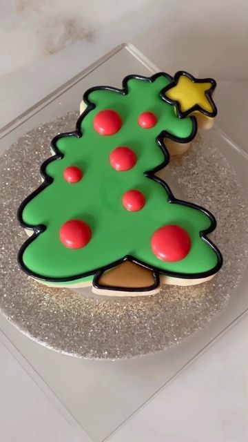 Charming Festive Christmas Tree Cookie with Vibrant Icing and Shimmering Silver Base