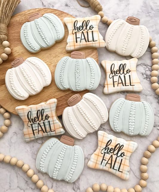 Cozy Autumn-Themed Cookies on a Rustic Wooden Platter