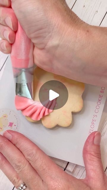 Elegant Sugar Cookies with Intricate Soft Pink Piping Design.