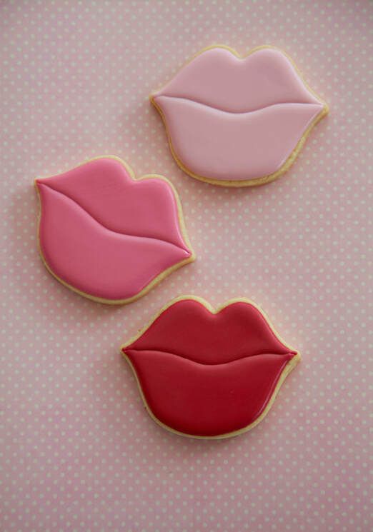 Playful Pink and Red Lip-Shaped Cookies for Whimsical Dessert Tables.