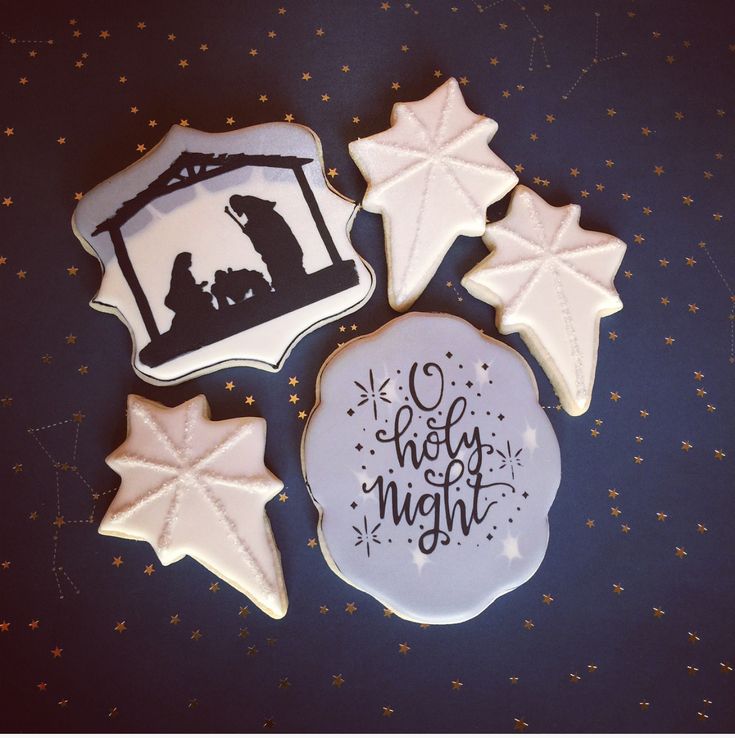 Elegant Festive Cookie Designs: Nativity and Star Shapes in White and Gold.