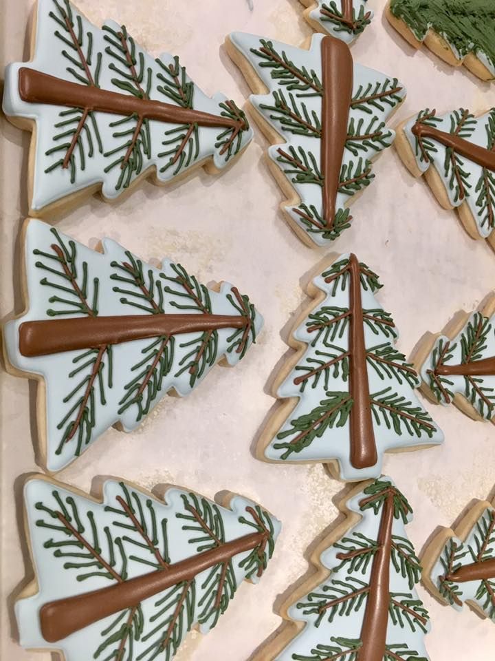 Charming Festive Tree-Shaped Cookies with Blue Icing and Pine Needle Details