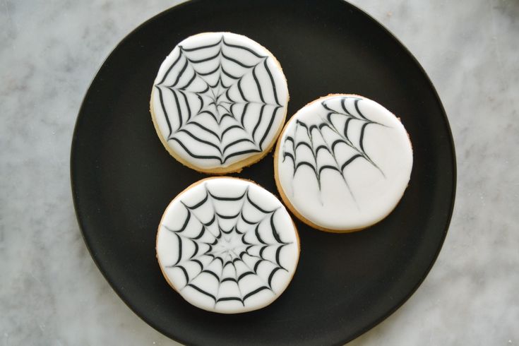 Elegant Cookie Design: Delicate Spider Web Icing on White Background Perfect for Seasonal Celebrations.