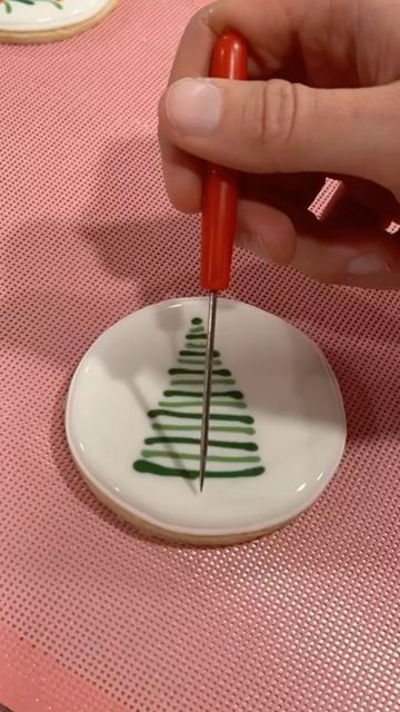 Holiday Nail Art Inspiration: Intricate Green Christmas Tree Design on Ceramic Plate.