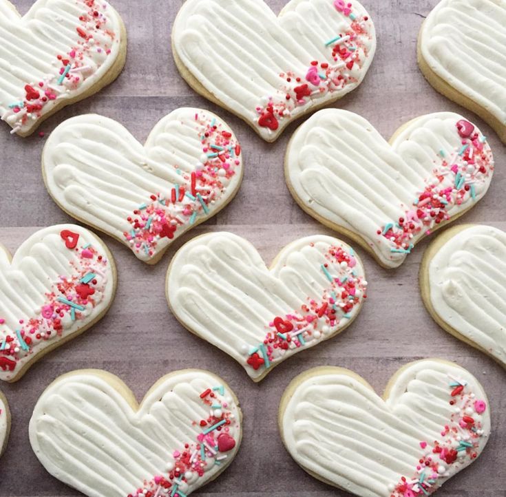 Whimsical Heart-Shaped Cookies: Festive Treats Adorned with Colorful Sprinkles and Icing.