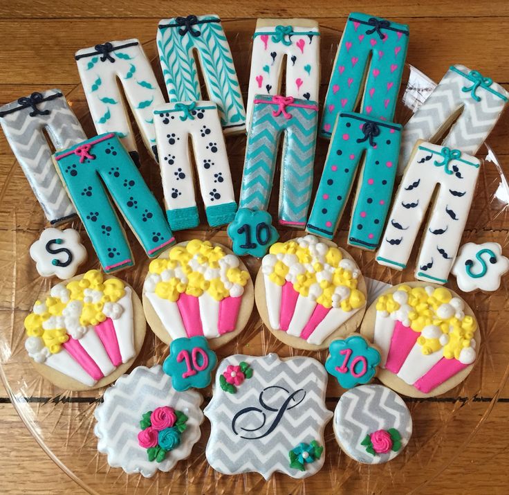 Festive Pajama-Themed Display of Colorful Cookie Designs and Popcorn Treats.