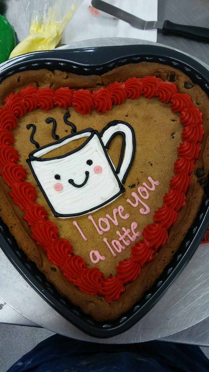 Heart-Shaped Cookie Cake with Cheerful Coffee Cup Illustration for Affectionate Expressions.