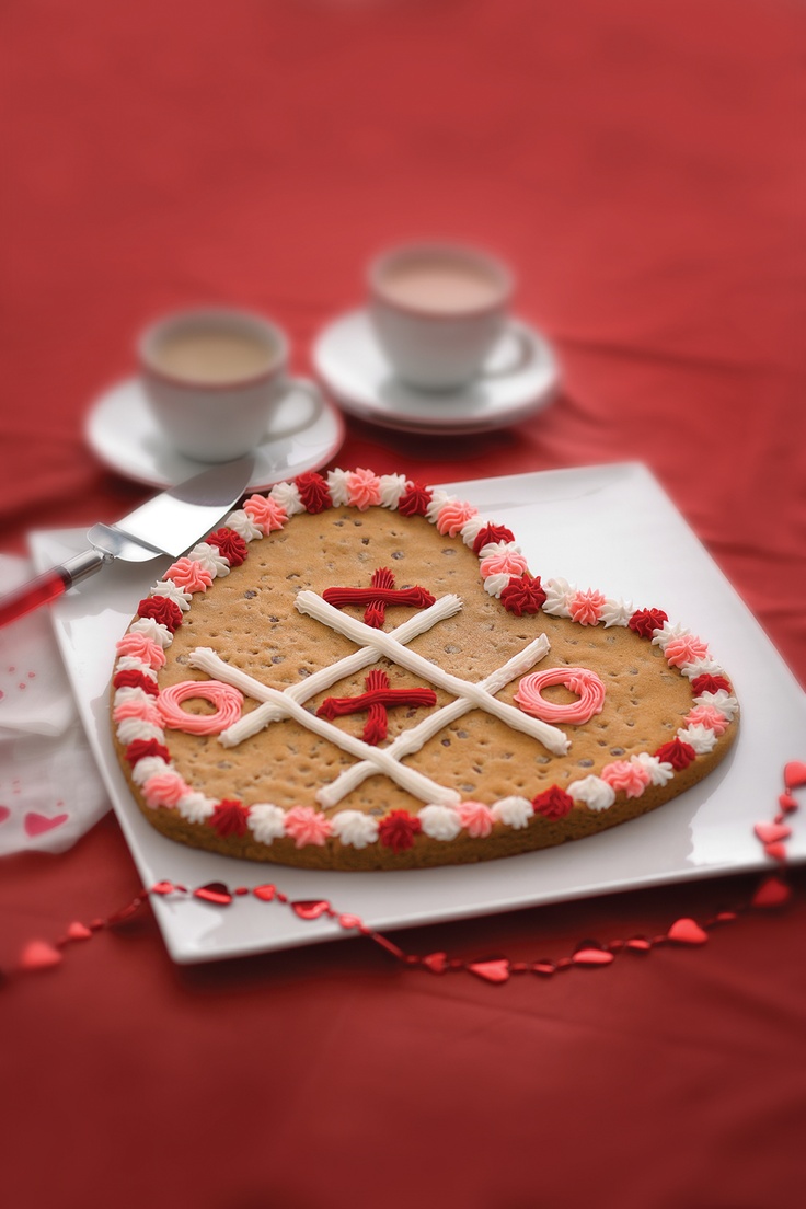 Festive Heart-Shaped Cookies with Playful Tic-Tac-Toe Design and Icing.