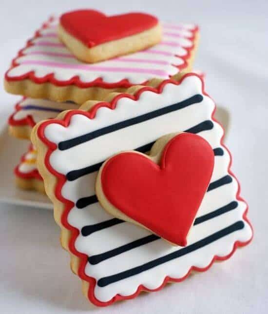 Heart-Shaped Cookies Inspire Festive Nail Designs with Colorful Icing.