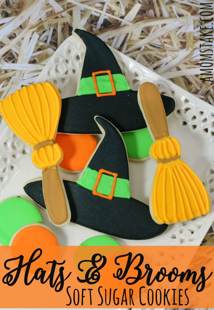 Charming Whimsical Halloween Sugar Cookies with Colorful Witch Hat and Broomstick Designs.