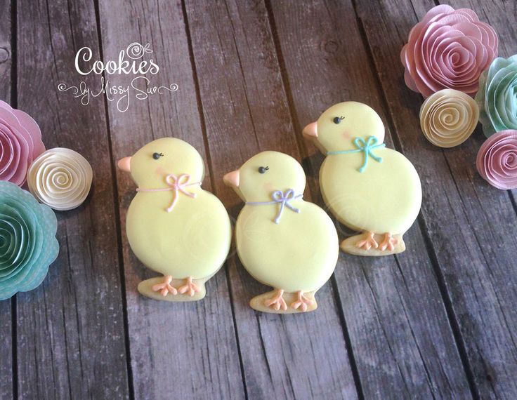 Charming Spring Dessert: Whimsical Chick-Shaped Cookies with Pastel Paper Flowers.